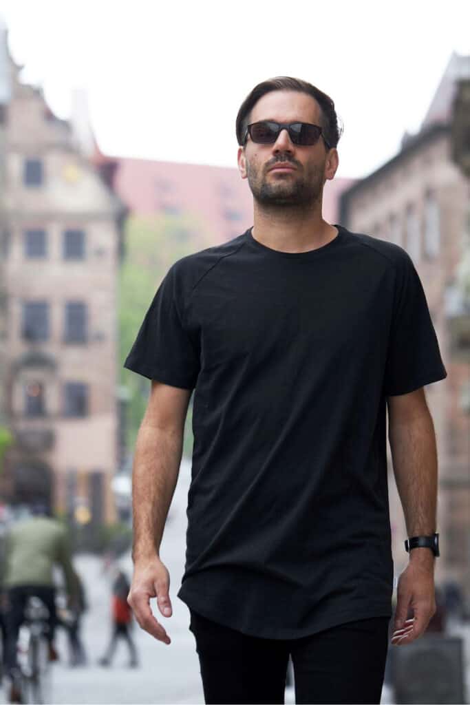 About us Brad profile pic man walking through the city